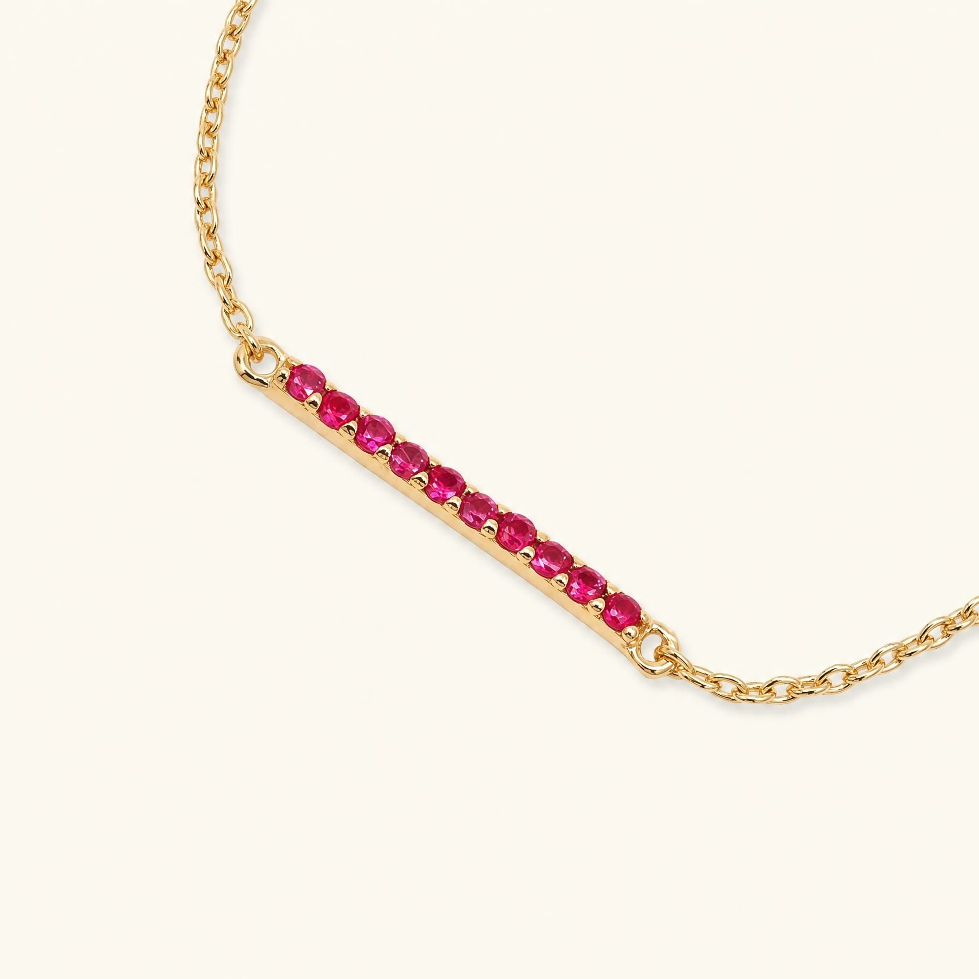 Long bar ruby bracelet in yellow gold