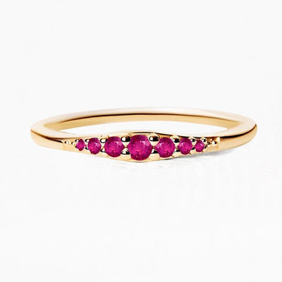 Gradient ruby wedding band in yellow gold