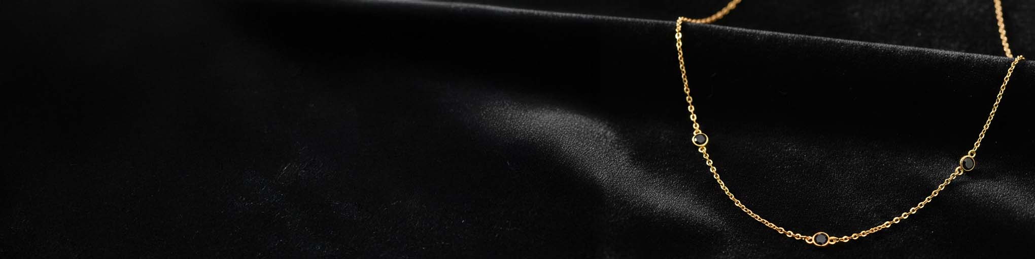 Vermeil black diamond necklaces on luxurious black fabric background, fine elegant jewellery