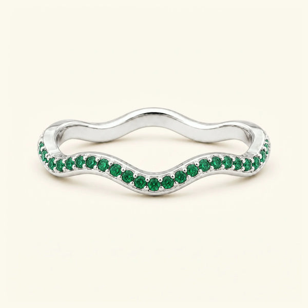 Thalassa wave wedding ring with emeralds in 18K white gold, half-eternity pavé set