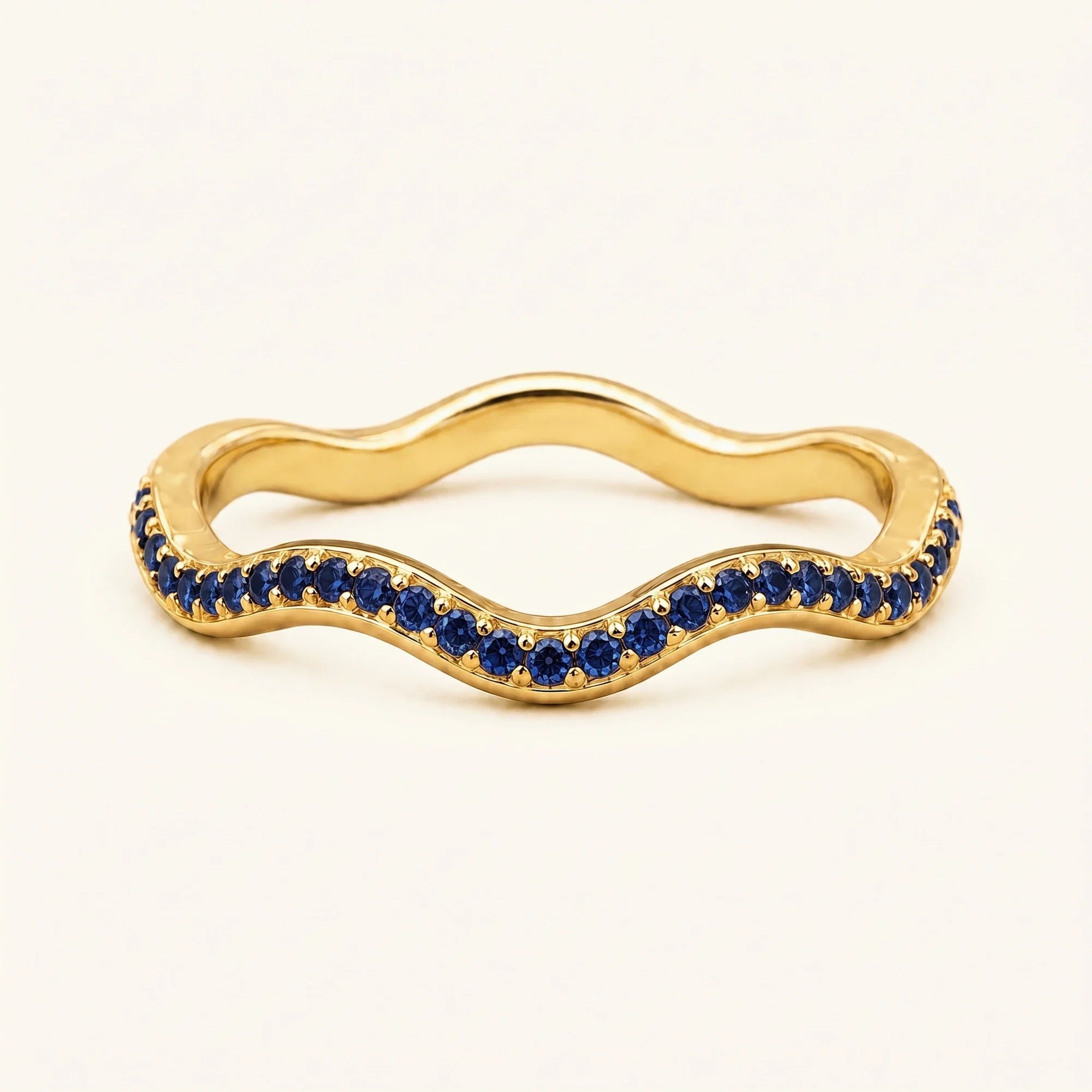 Thalassa wave wedding ring with sapphires in 18K yellow gold, half-eternity pavé set