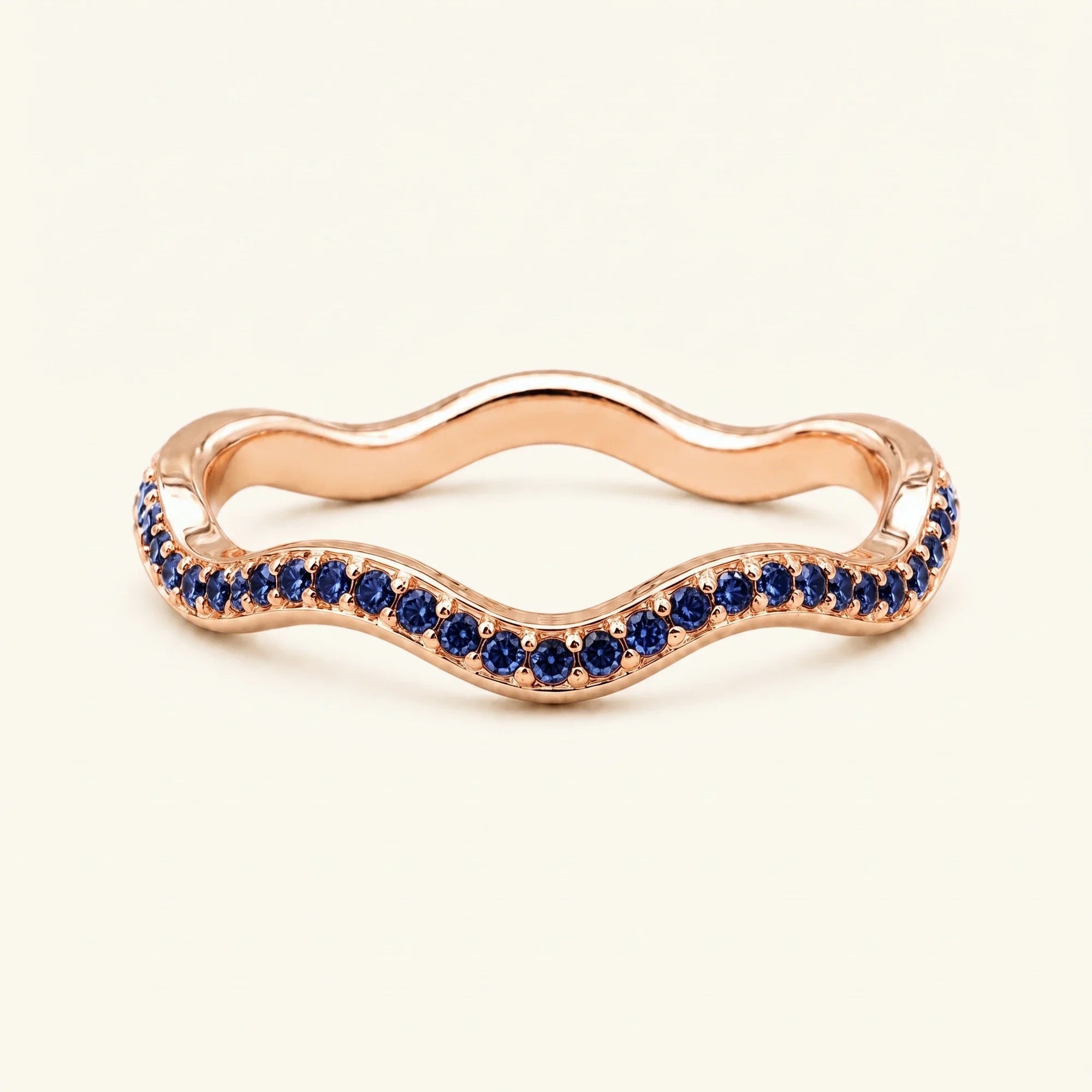 Thalassa wave wedding ring with sapphires in 18K rose gold, half-eternity pavé set