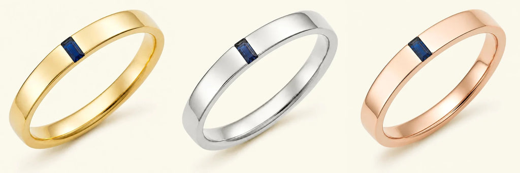 The Agni men's engagement ring in 18K yellow gold, white gold, and rose gold, set with a baguette cut Sapphire