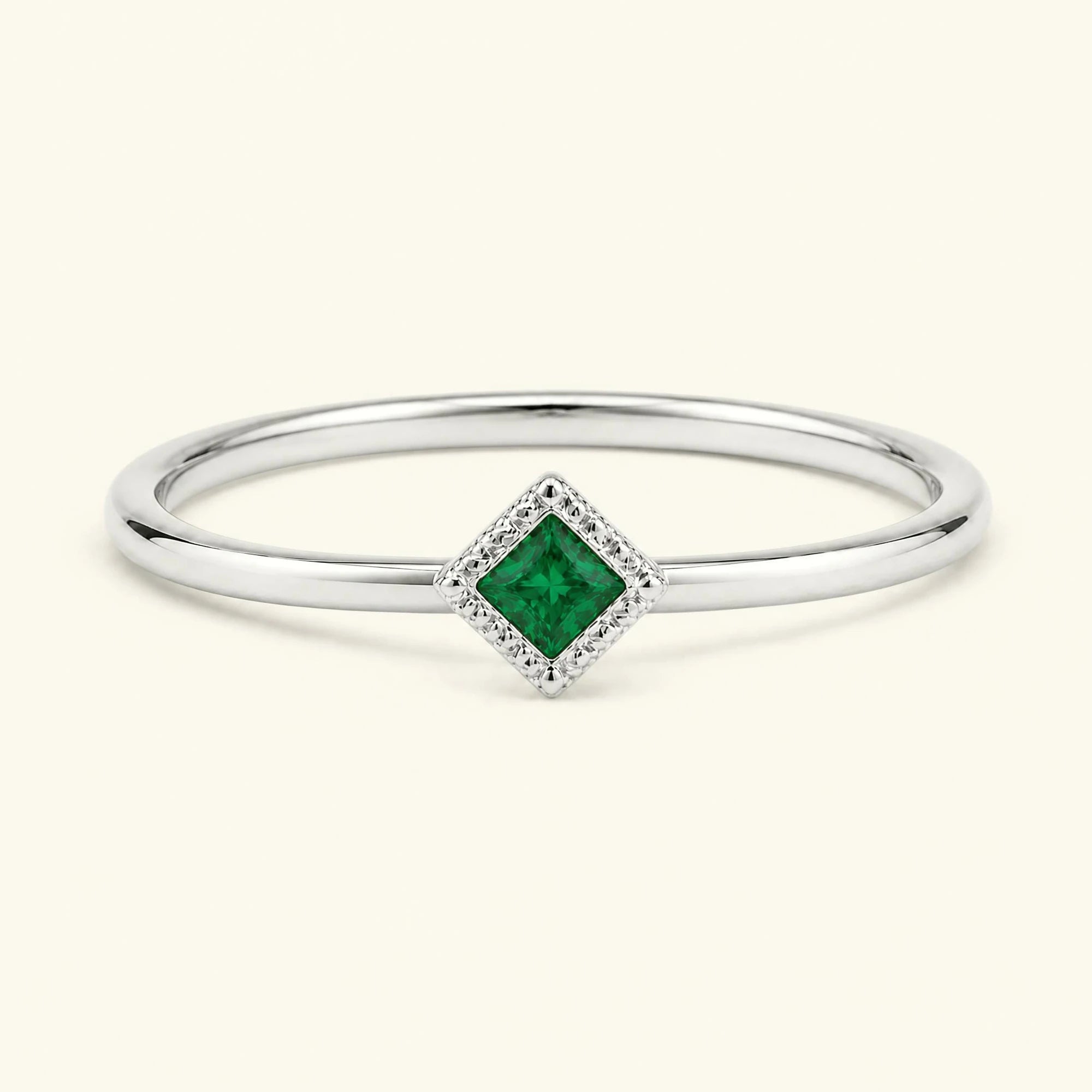 Vintage Indrani engagement ring — emerald solitaire princess cut 4 mm, square stone in twisted rope setting, 18K white gold