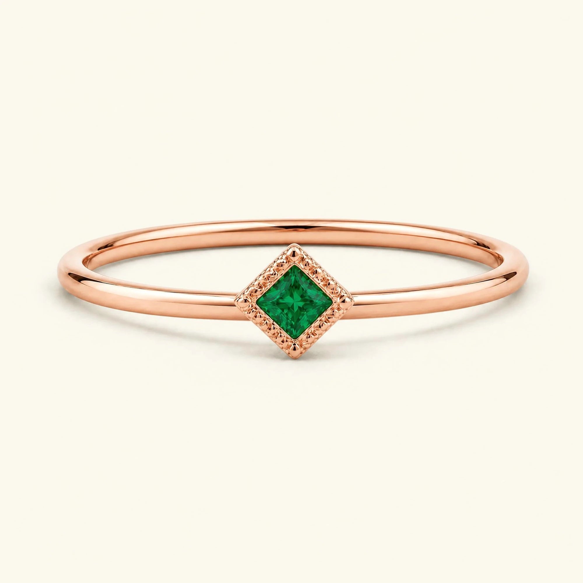 Vintage Indrani engagement ring — emerald solitaire princess cut 4 mm, square stone in twisted rope setting, 18K rose gold