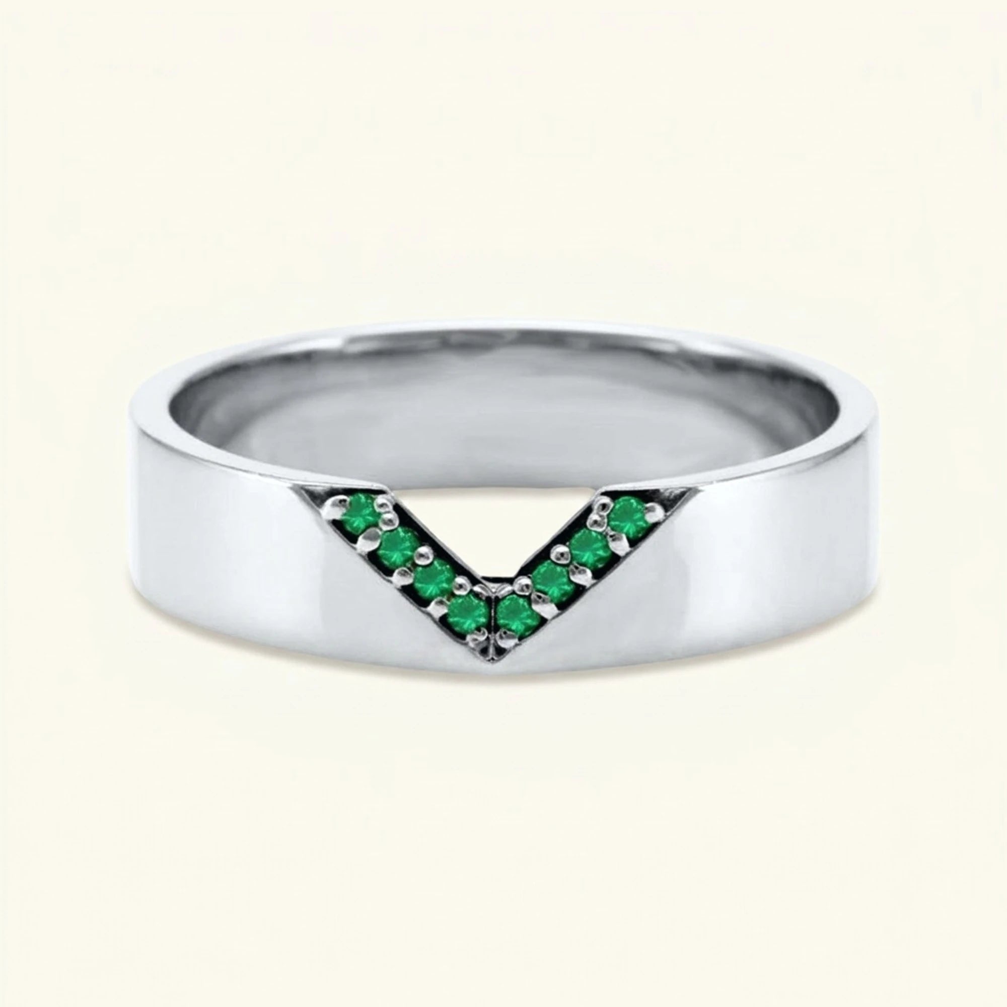 V-shaped ring pavé set with emeralds for men in white gold