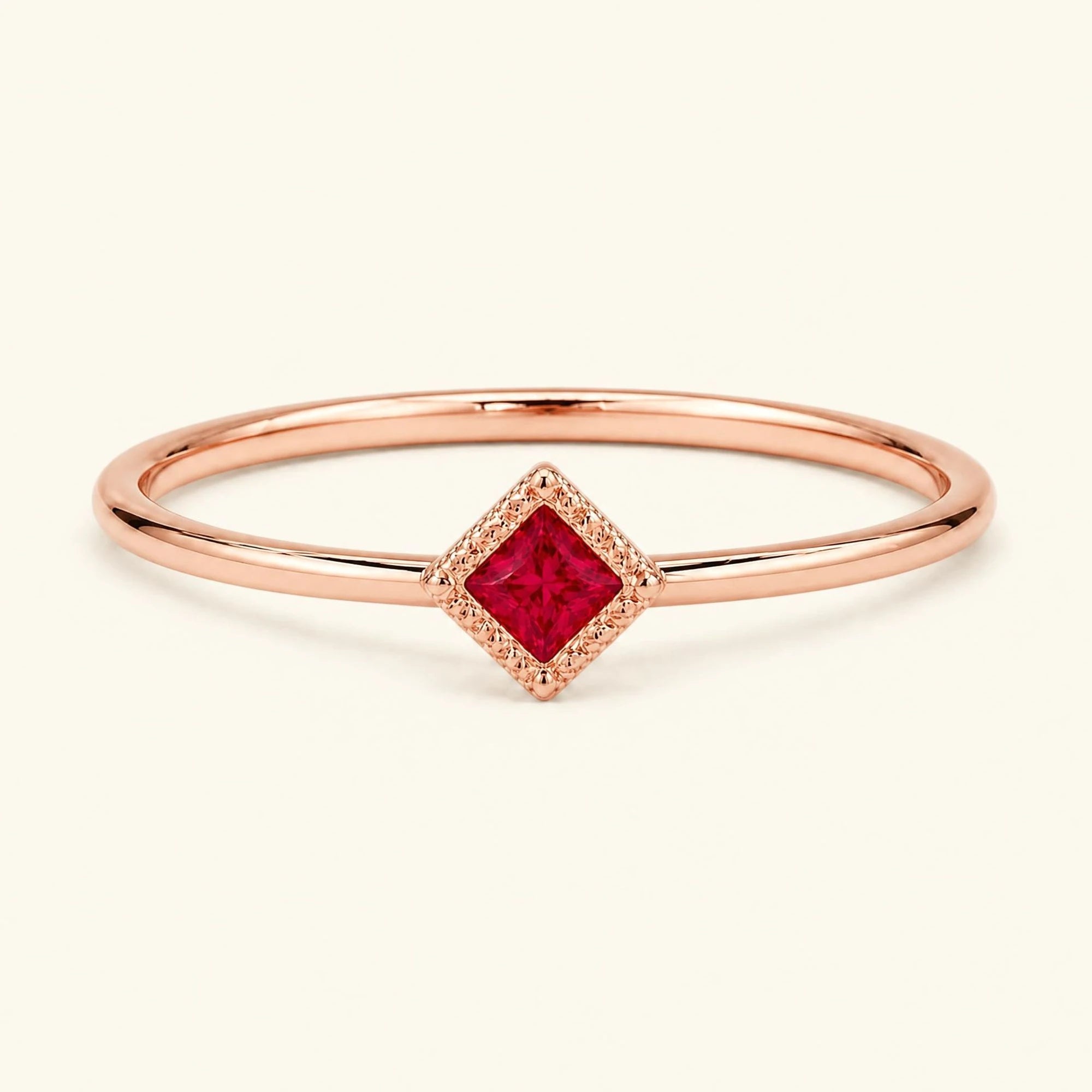Vintage Indrani engagement ring — ruby solitaire princess cut 4 mm, square stone in twisted rope setting, 18K rose gold