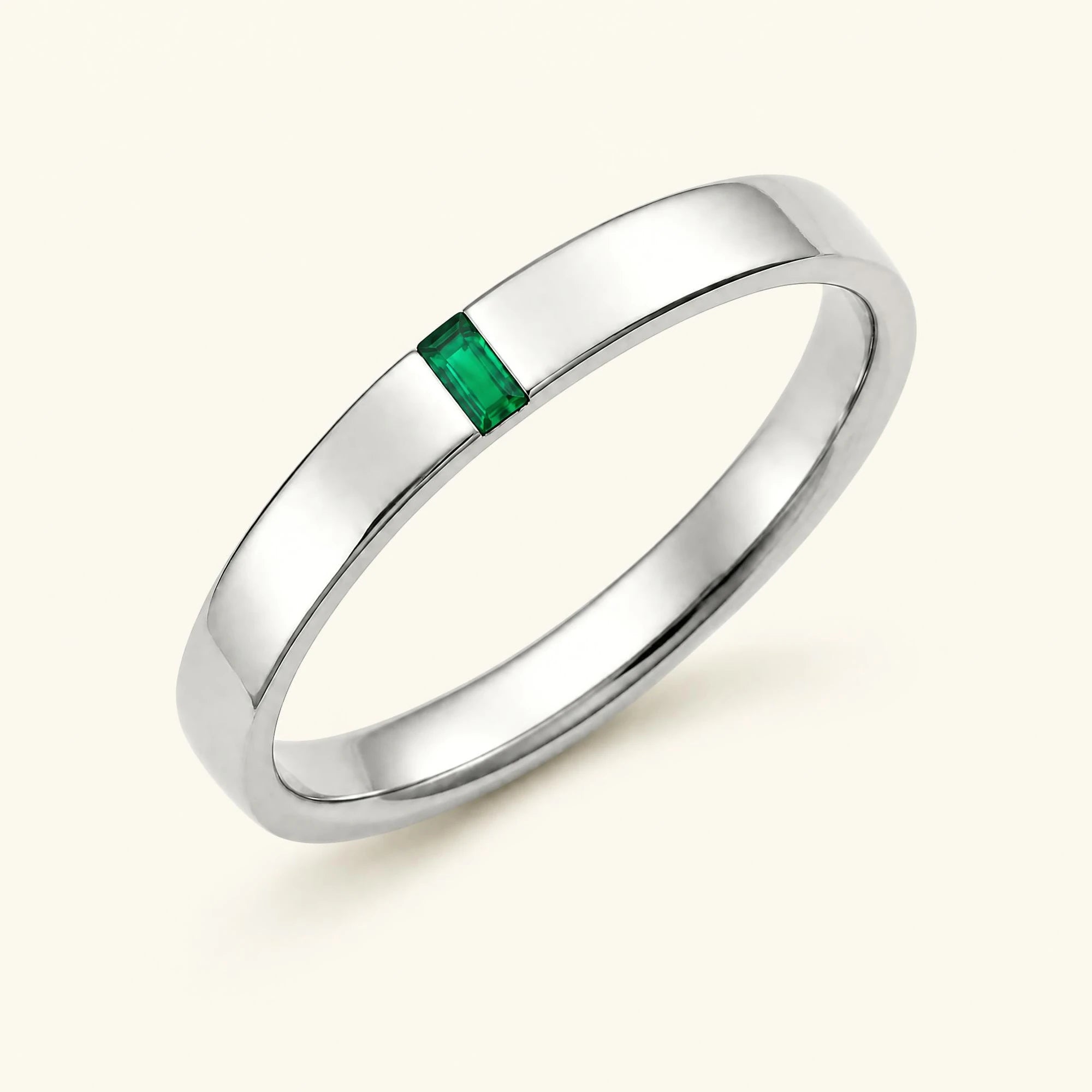 Bague solitaire baguette d'émeraude pour homme en or blanc