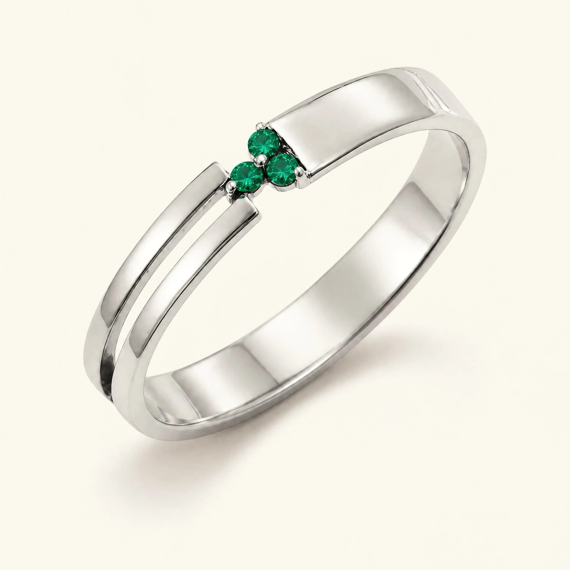 Three-stone emerald ring for men in white gold