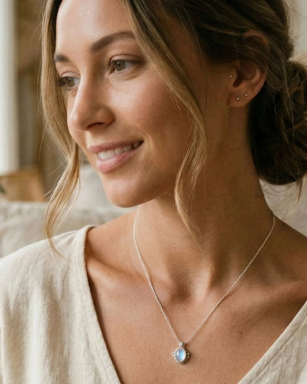 Moonstone necklace worn as a pendant, cabochon-cut with blue adularescence