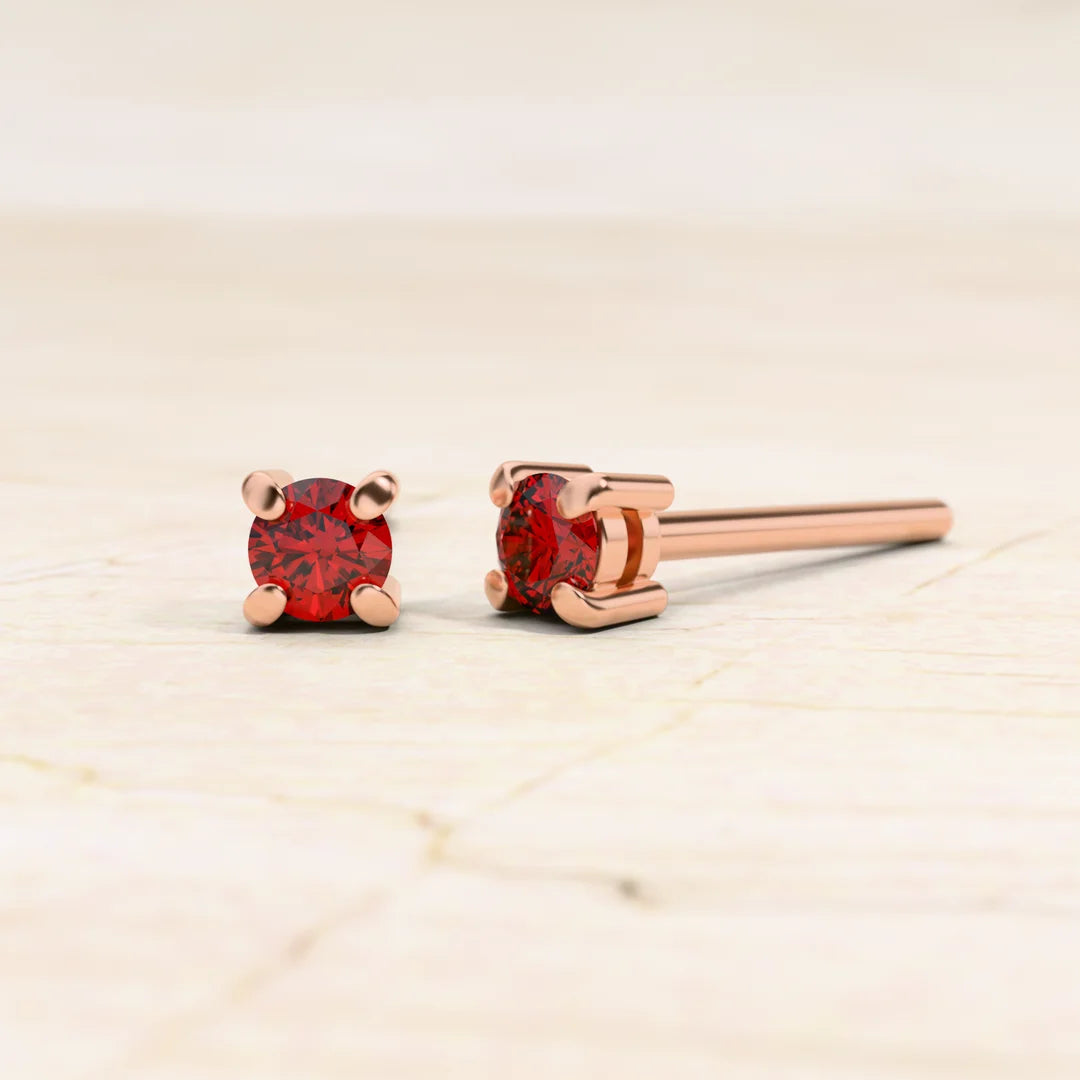 Boucles d'oreilles solitaire rubis en or rose 18cts