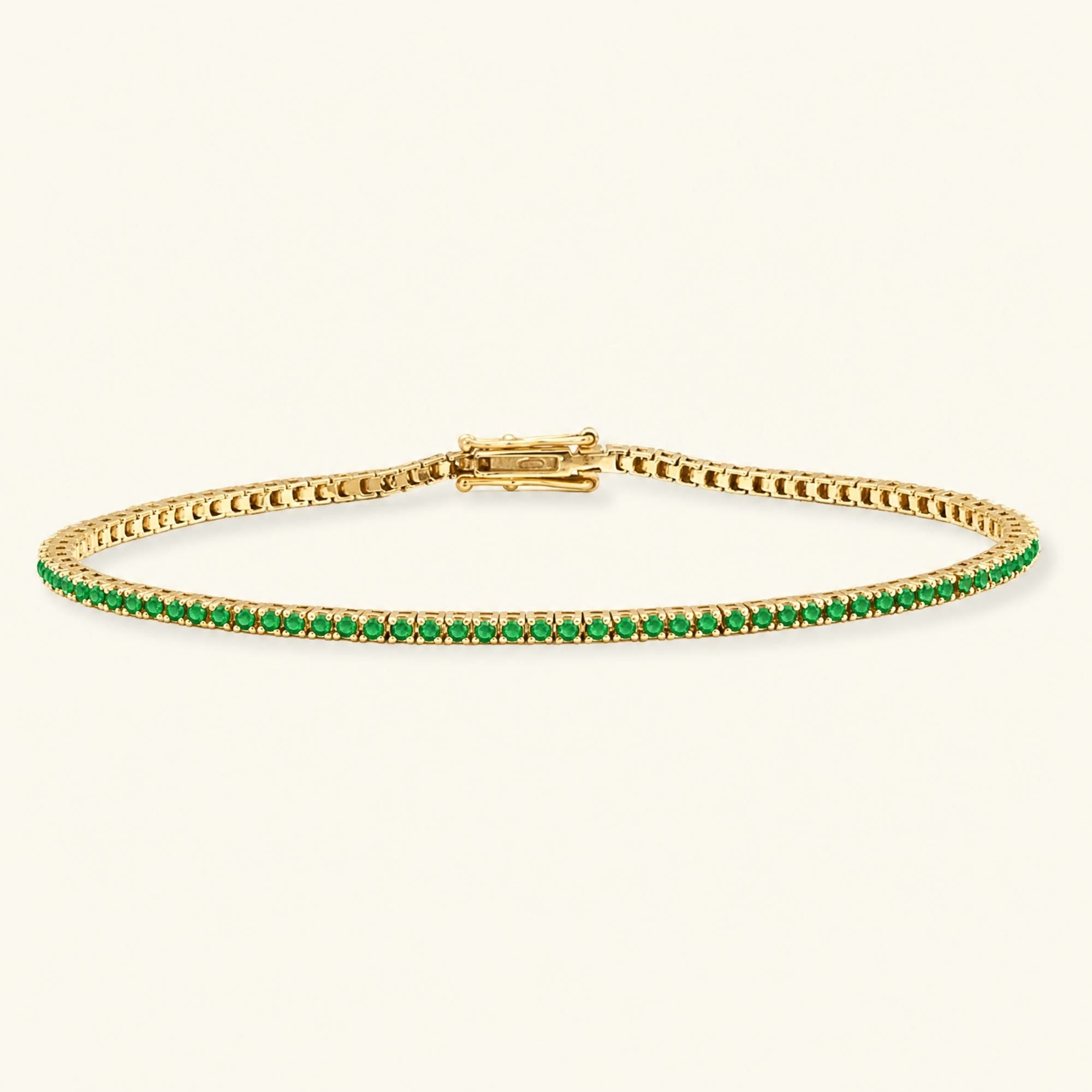Bracelet tennis rivière émeraude en or jaune 18cts