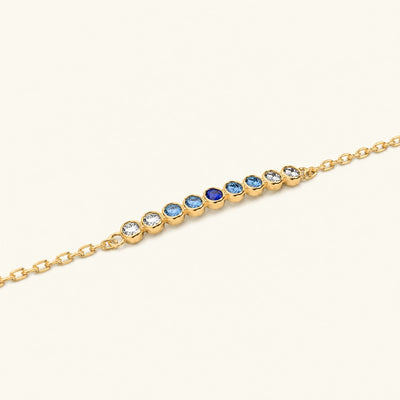 Noor yellow gold bracelet with horizon sapphire