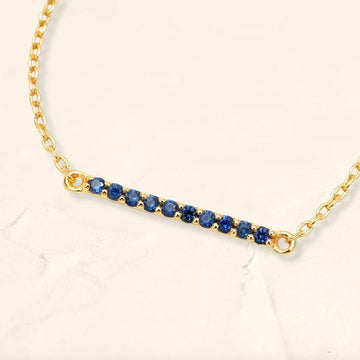 Long bar bracelet with rubies in yellow gold