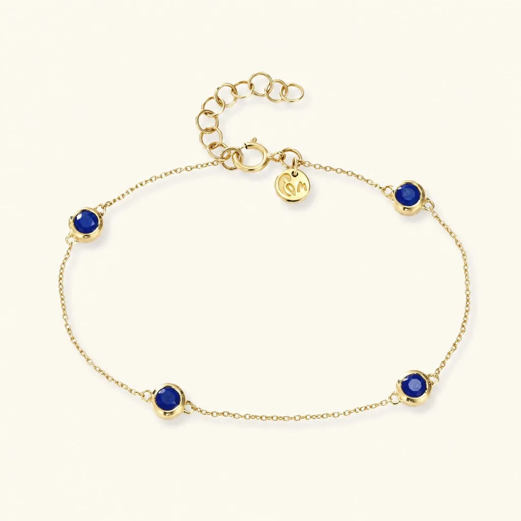 Dhanya bracelet in 18K yellow gold with four bezel-set sapphires, a bridesmaid gift