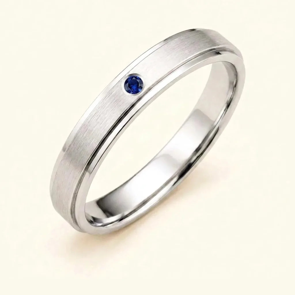 Dhruva men's ring in 18K white gold with a flush-set sapphire, a best man gift