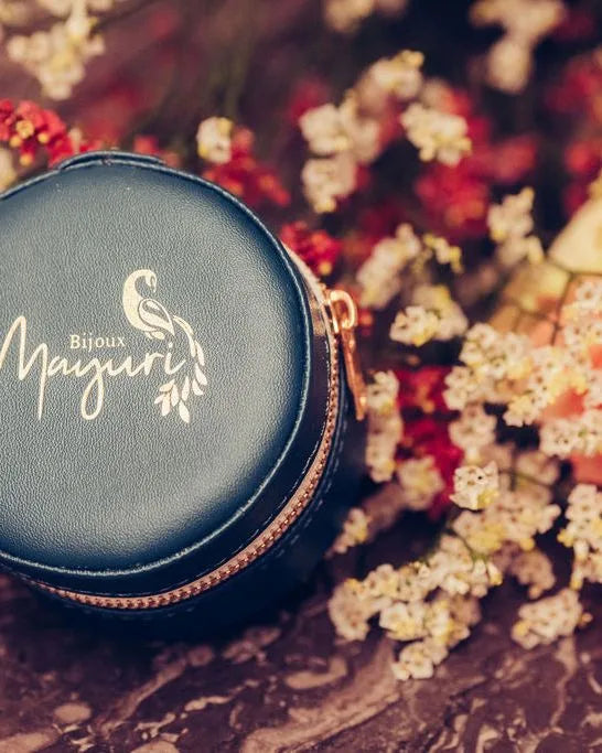 Mayuri round turquoise velvet case with fine jewellery on lifestyle floral background