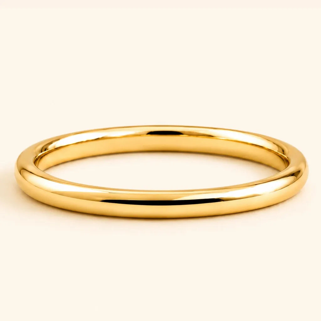 Shunya round bangle wedding ring in 18K yellow gold with a polished, high-shine finish, by Mayuri