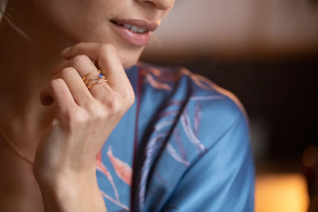 Kali and Nisha rings in 18K yellow gold set with blue Sapphires and Diamonds, worn on the hand