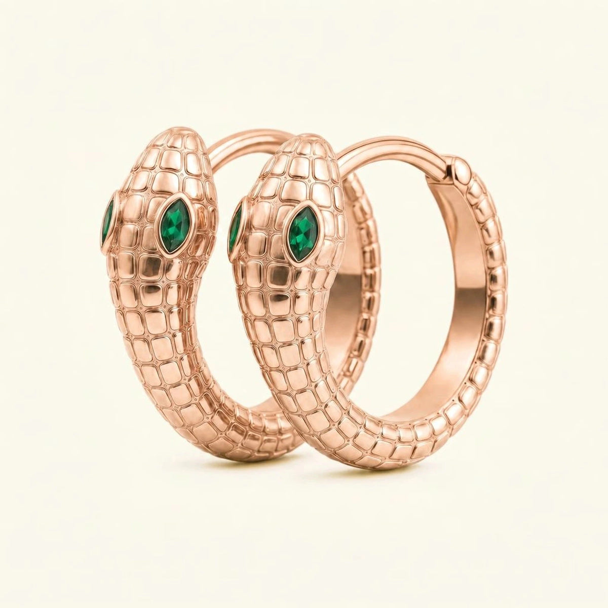 Méhen snake hoop earrings in 18K rose gold, scaled body and marquise emerald eyes