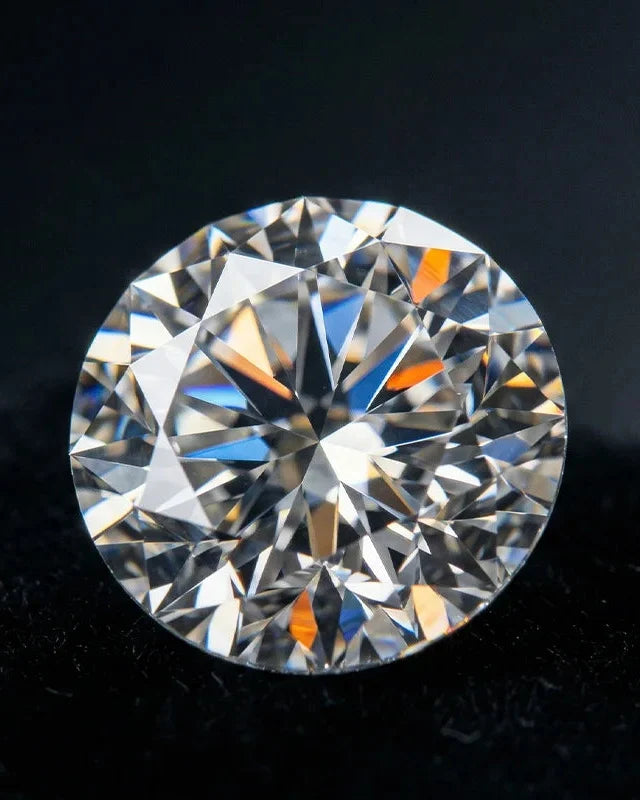 Close-up of a natural brilliant cut diamond, light dancing across its facets